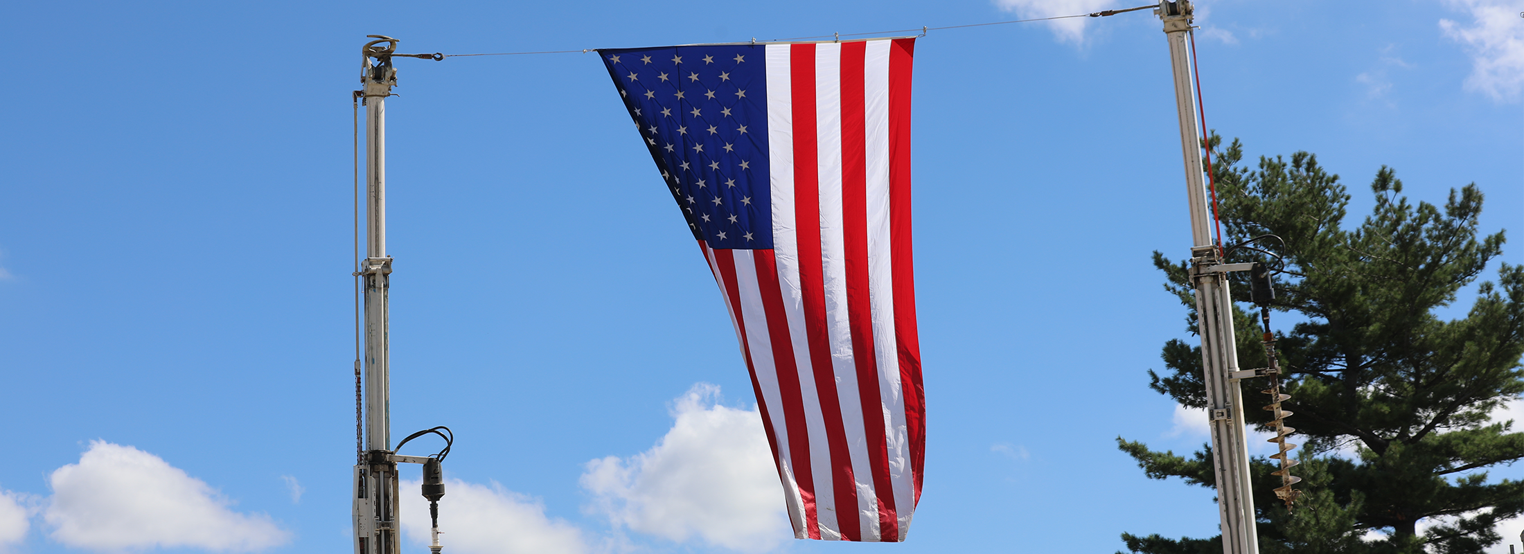 flag in the air with bucket truck arms